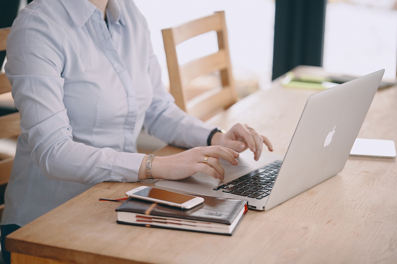 Person typing on a laptop